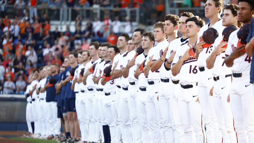 Virginia players stand along the baseline before their pivotal Super Regional battle with Kansas State.&nbsp;