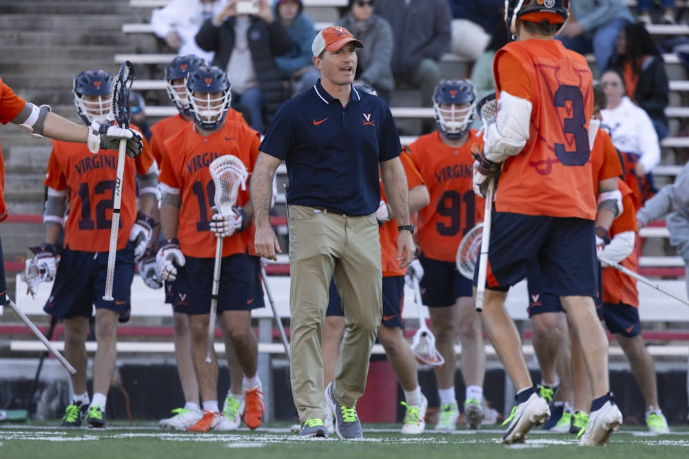 Cassese encourages sophomore attackman Truitt Sunderland during the Cavaliers' game against Maryland.&nbsp;
