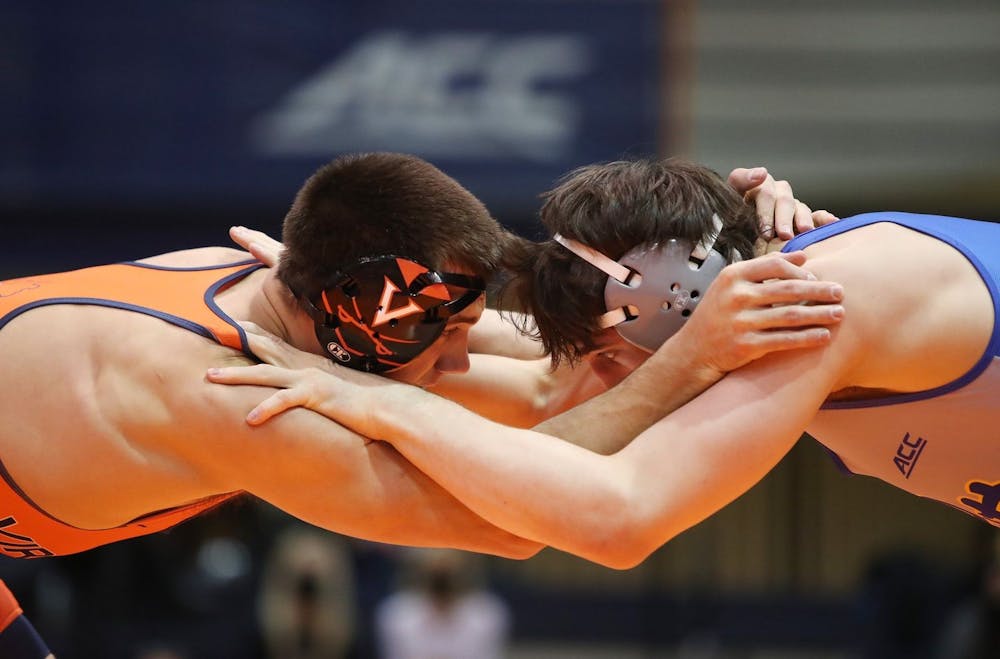 Graduate student Jay Aiello grapples with an opponent in Virginia's 25-10 loss to No. 18 Pittsburgh last Friday.